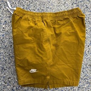 Nike Club Men's Woven Flow Shorts in a "Wheat Gold